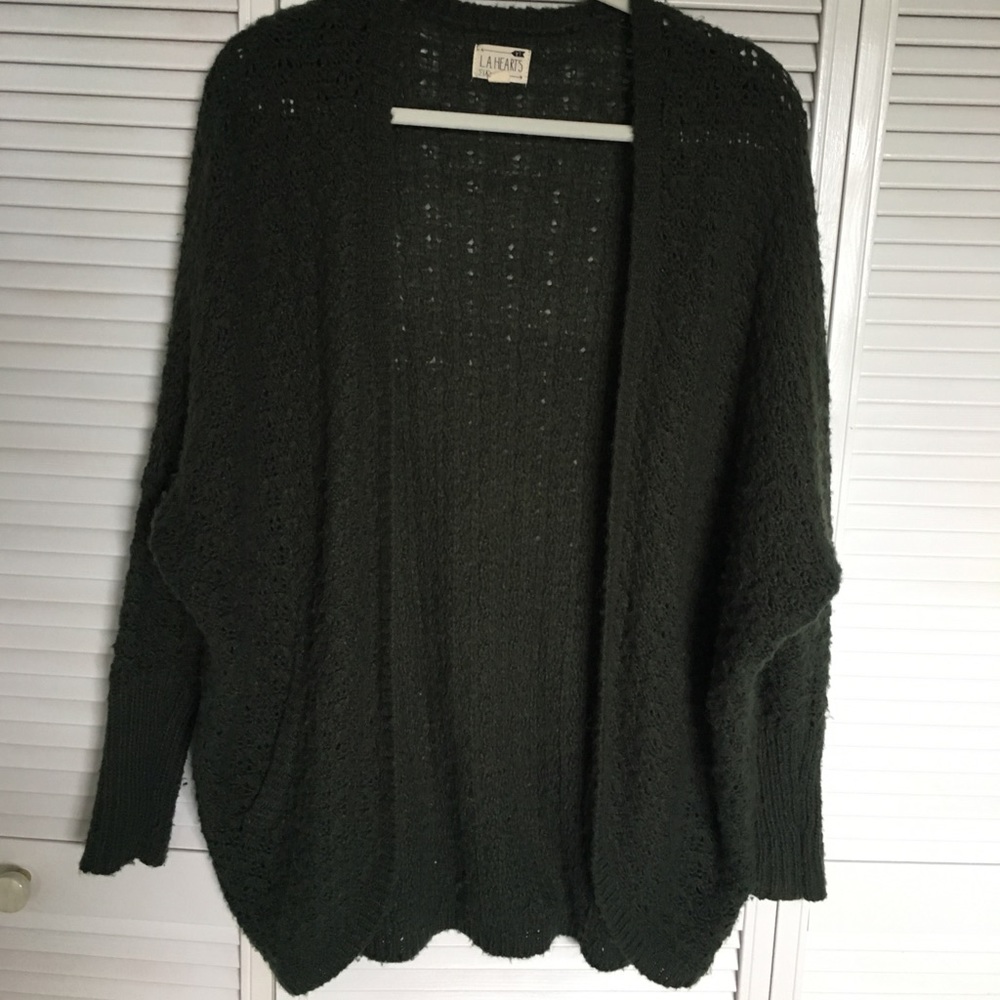A knitted green cardigan.
